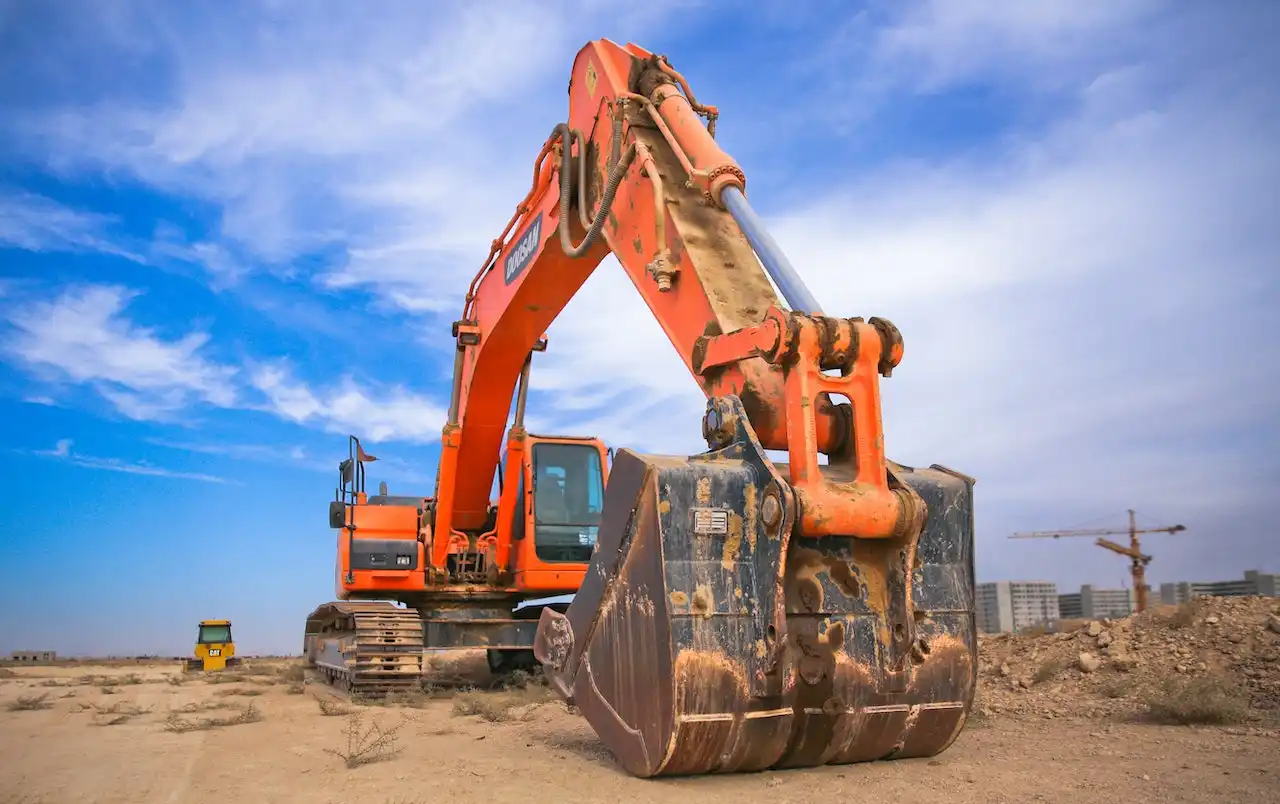 Picture of a crane at a construction site preparing construction waste disposal