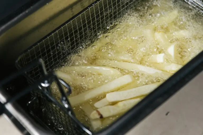 Picture of french fries in boiling grease for the blog about how to dispose of cooking oil.