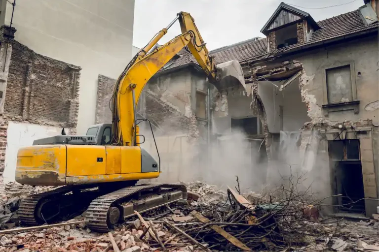 Picture of demolition crane tearing down a building for the blog about recycling building materials