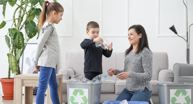 Picture of a parent teaching kids about Global Recycling Day.